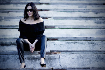 Woman on the stadium wearing black