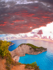 Navagio beach with shipwreck against colorful sunset, Zakynthos island, Greece