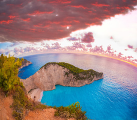 Navagio beach with shipwreck against colorful sunset, Zakynthos island, Greece