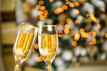 Two Champagne Glass On Defocused Background Living Room With Christmas Tree