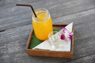 Orange juice on wood background