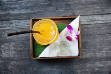 Orange juice on wood background