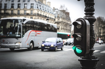 Green traffic light in the streets of Paris, France