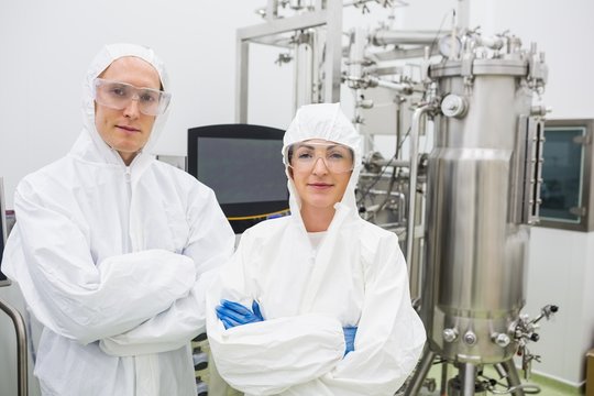 Scientists working with large vat