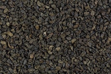 Background texture of dried, green, gunpowder tea.