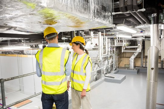 Engineers checking the temperature pipes
