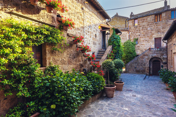 Stairs with colorful flowers in a Tuscan old town
