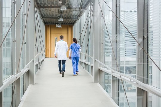 Medical Team Walking Down Hallway