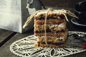 Cake with cherries and a cup of coffee
