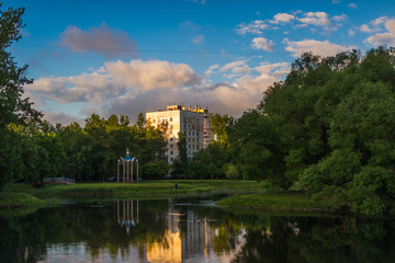 Fototapeta na wymiar Residential buildings by the lake in nature in St. Petersburg, Russia