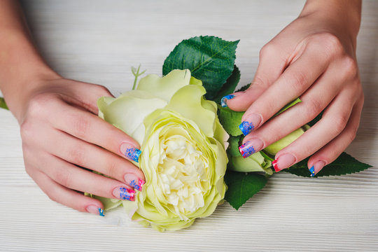 French nail art on wooden background