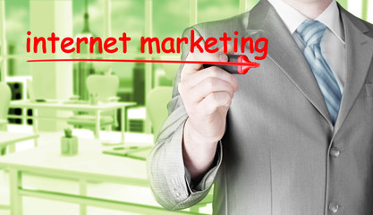 business man writing internet marketing