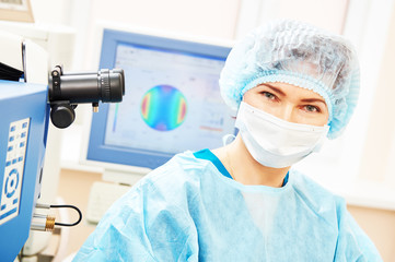 female eye surgeon in operation room - obrazy, fototapety, plakaty