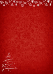 Red Christmas background with tree and decorations with copy space