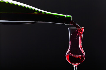 bottle and glass with alcoholic drink
