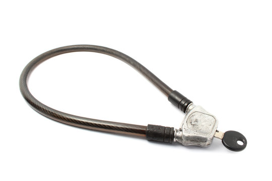 Fototapeta bike cable lock with key isolate on white