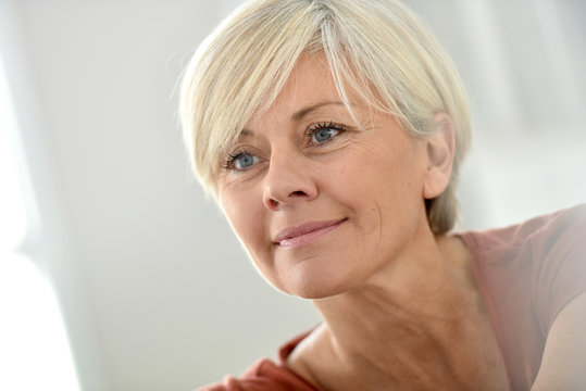 Portrait of smiling blond senior woman