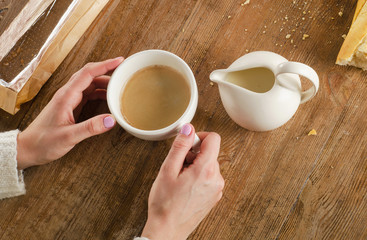 Woman Hand holding a Coffee cup.