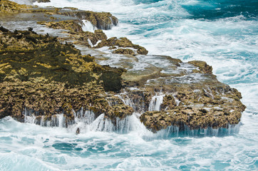 Sea water splashing on the sea rocks in Cura&ccedil;ao