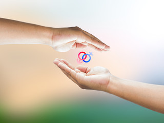 Human hand holding Mars Venus or Male Female symbol. Safe Sex co