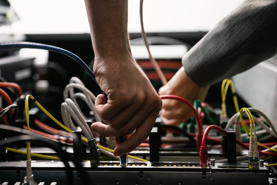 Team of technicians working together on servers