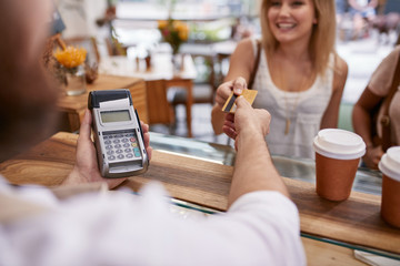 Customer paying at a cafe with credit card