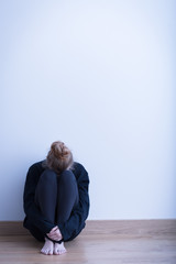 Despair girl in empty room