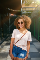 Beautiful young black woman smiling at camera