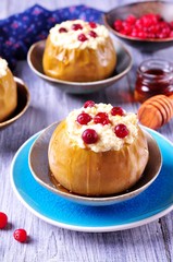 Apples baked with cheese and cranberries poured honey. Healthy breakfast.