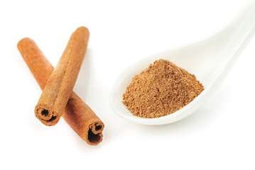 Cinnamon sticks and powder on white background