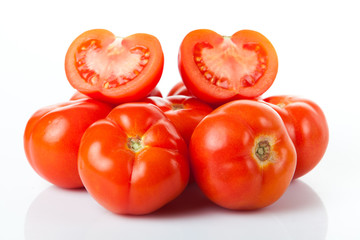 Fresh tomatoes isolated on white.