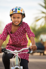 Fototapeta na wymiar Happy Girl Riding Bike