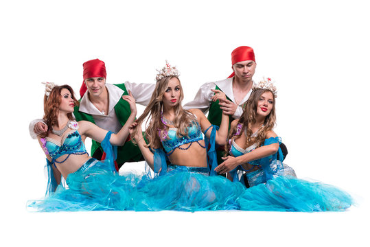 Carnival dancer team dressed as mermaids and pirates.  Isolated on white background in full length
