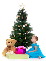 elegant girl near the Christmas tree
