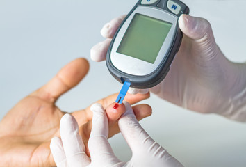 blood glucose meter, the blood sugar value is measured on a finger