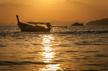 long-tail boat and sunset