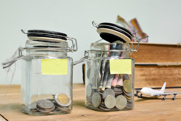 Jar for savings full of coins.