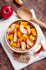 Pumpkin and apples in a bowl