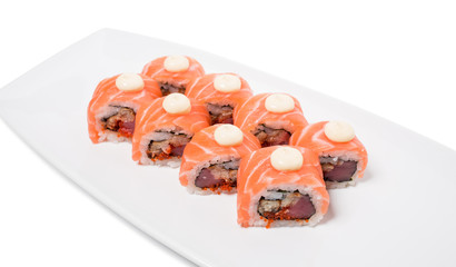 Uramaki salmon roll with scallop.