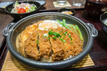 Deep Fired pork boiled  with fresh egg top on the rice bowl. basic Japanese food