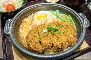 Deep Fired pork boiled  with fresh egg top on the rice bowl. basic Japanese food