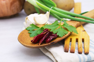 Wooden spoon and fork with parsley