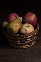 Apples and pears in a wicker basket