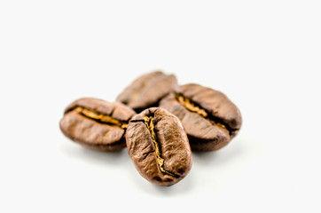 Close up roasted coffee beans isolated on white background