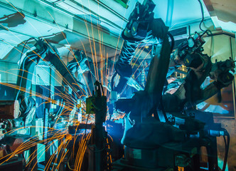 Team Welding robots movement in a car factory