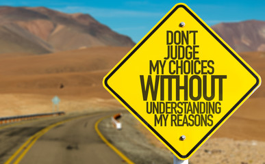 Don't Judge My Choices Without Understanding My Reasons sign on desert road
