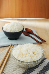 White rice in bowl with wooden chopsticks