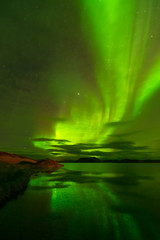 Fototapeta na wymiar Northern lights (Aurora Borealis) reflected in the lake