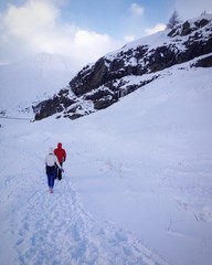 Fototapeta na wymiar Walking among snowy alps