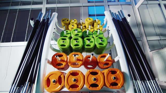 Rack with weights in the gym for the rod